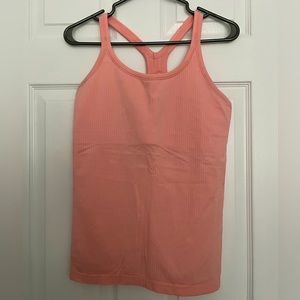 Pinkish lululemon tank top size 10 - ebb to street tank top